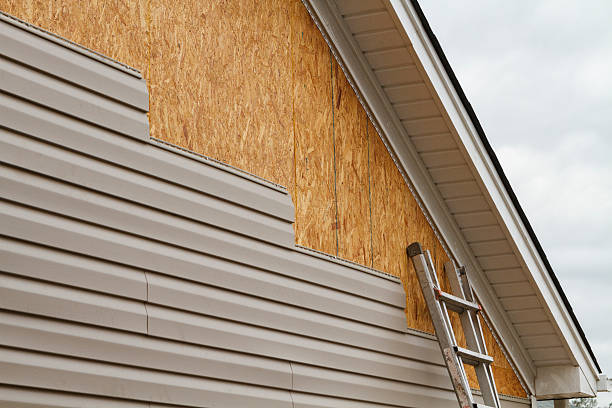 Professional Storm Damage Siding Repair technician working in Melville, NY